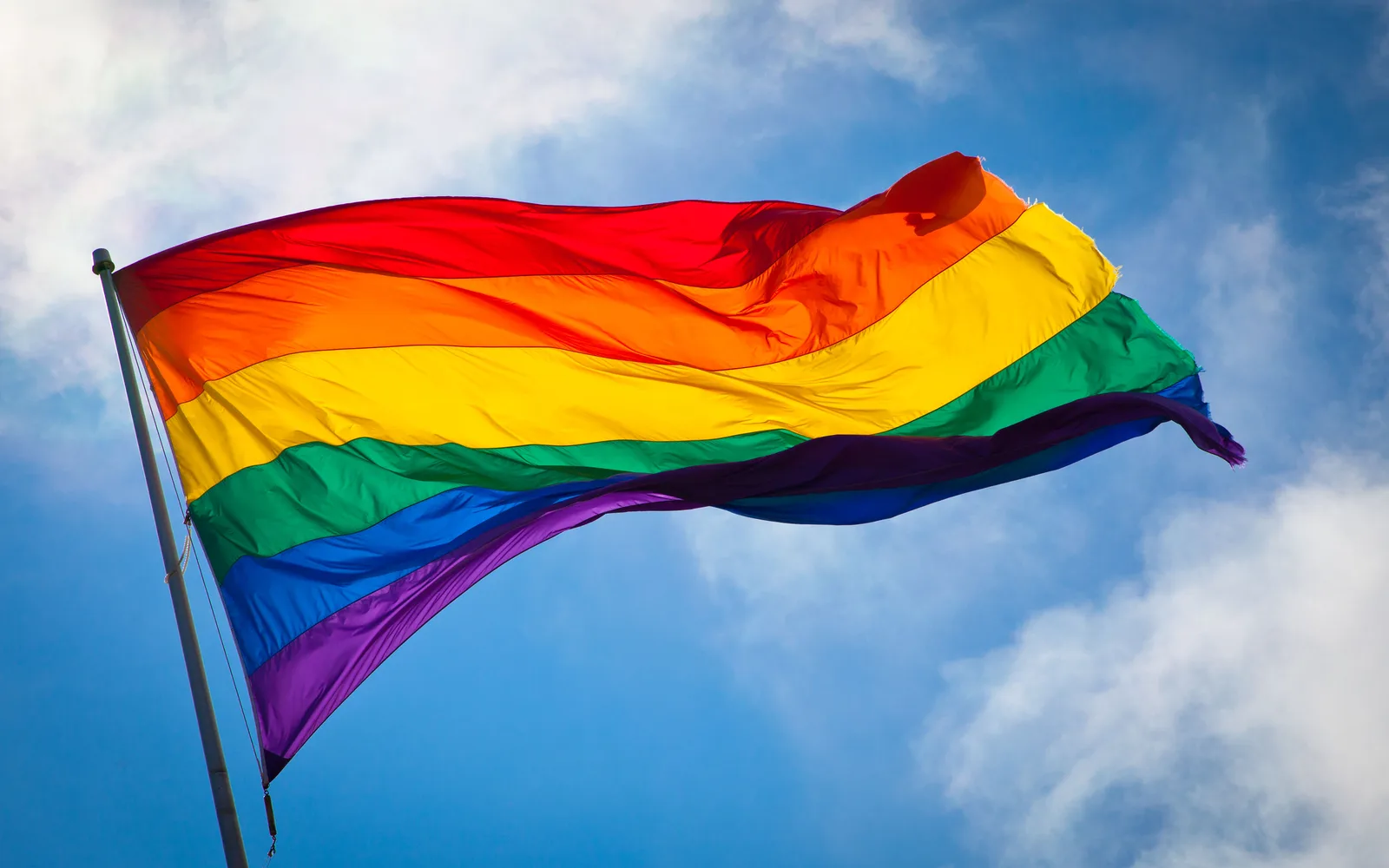 Rainbow pride flag waving in the breeze